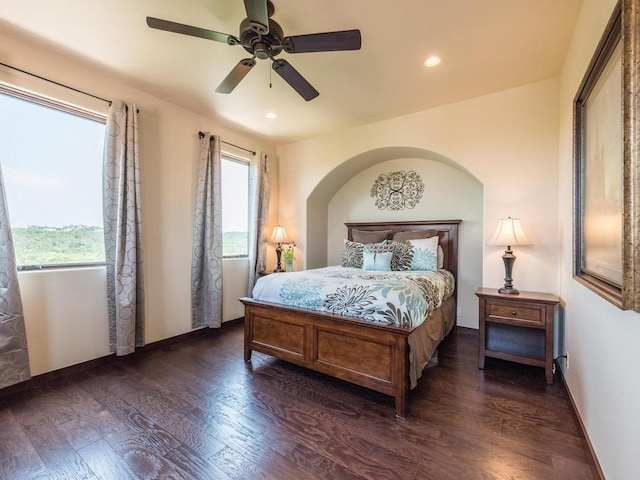 bedroom with ceiling fan and dark wood-type flooring