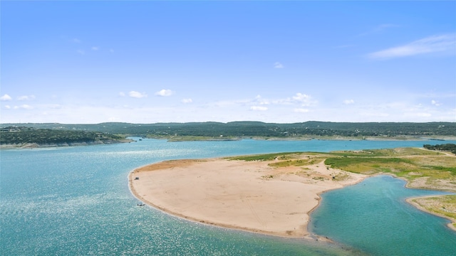 bird's eye view featuring a water view and a view of the beach