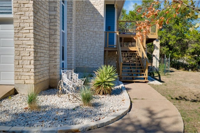 property entrance with a deck