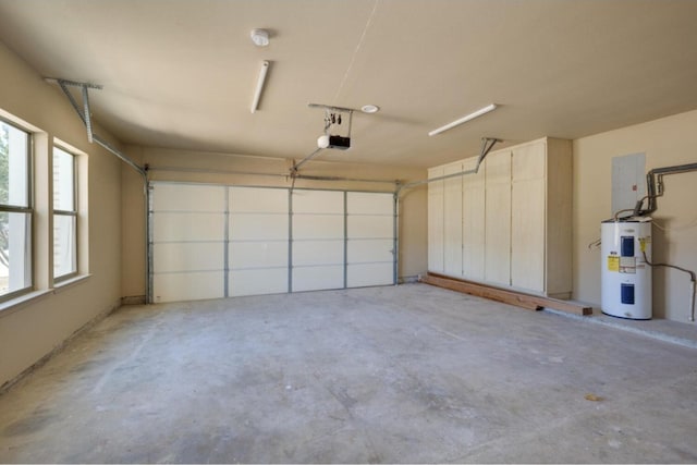 garage with a garage door opener and water heater