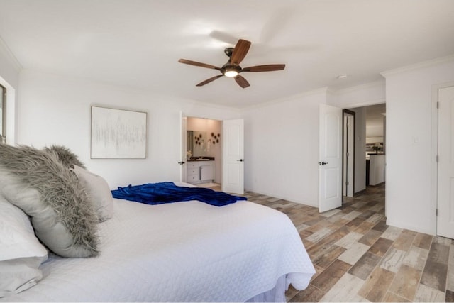 bedroom with ceiling fan, light hardwood / wood-style floors, crown molding, and ensuite bathroom