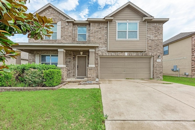 view of front of home with a front lawn and a garage