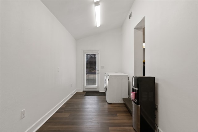 interior space with vaulted ceiling and dark hardwood / wood-style flooring