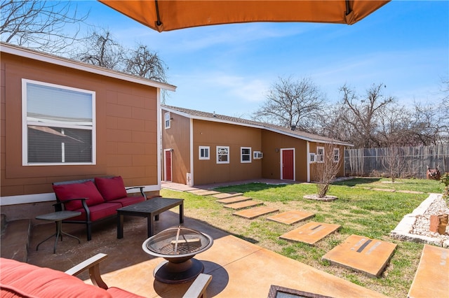 view of patio / terrace with an outdoor living space with a fire pit