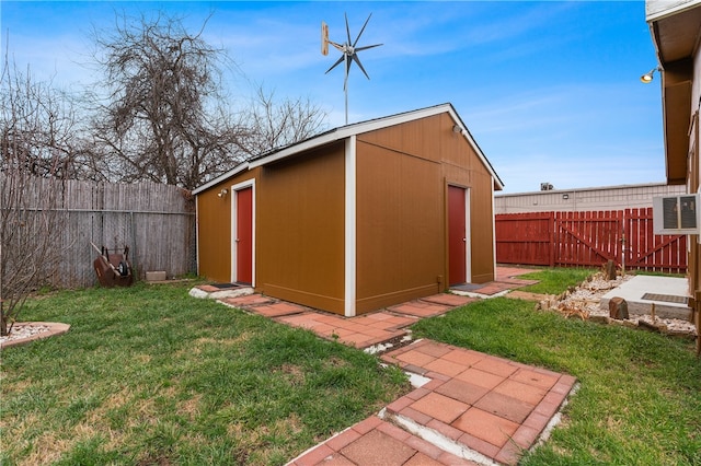 view of outbuilding with a lawn