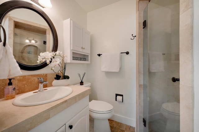 bathroom featuring an enclosed shower, tile flooring, large vanity, and toilet