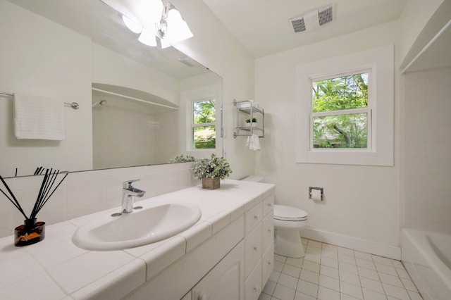 full bathroom with vanity, toilet, tile floors, and tub / shower combination