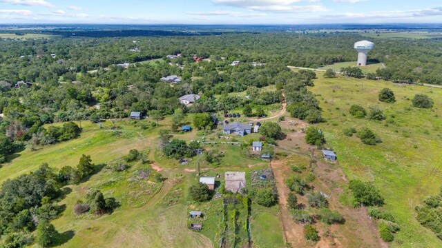 222 Pope Bnd N, Cedar Creek, TX 78612 - aerial overview of property's location with a heavily wooded area