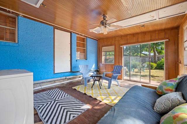 sunroom / solarium featuring ceiling fan, washer / clothes dryer, and wooden ceiling