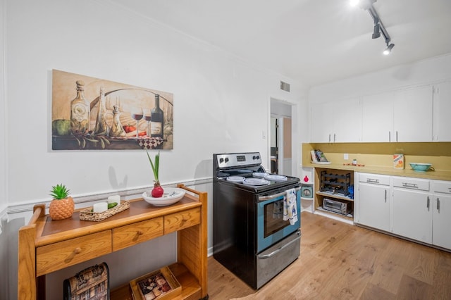 kitchen with white cabinetry, stainless steel electric range oven, rail lighting, and light wood-type flooring