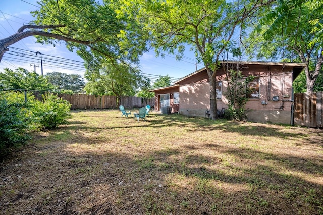 view of yard with central AC