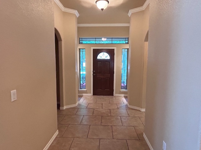 tiled entrance foyer with crown molding