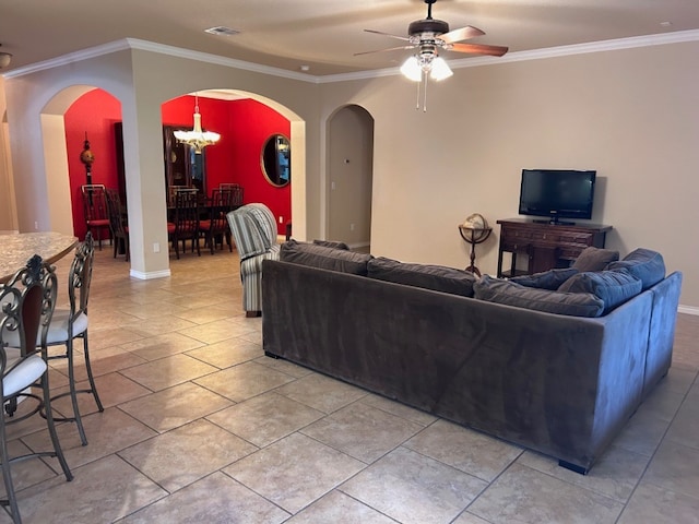 living room with ceiling fan with notable chandelier and ornamental molding