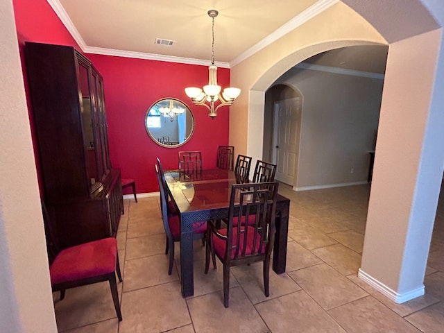 tiled dining room with ornamental molding and a notable chandelier