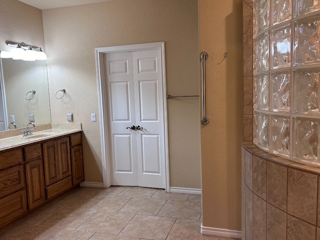 bathroom featuring tile patterned floors and vanity