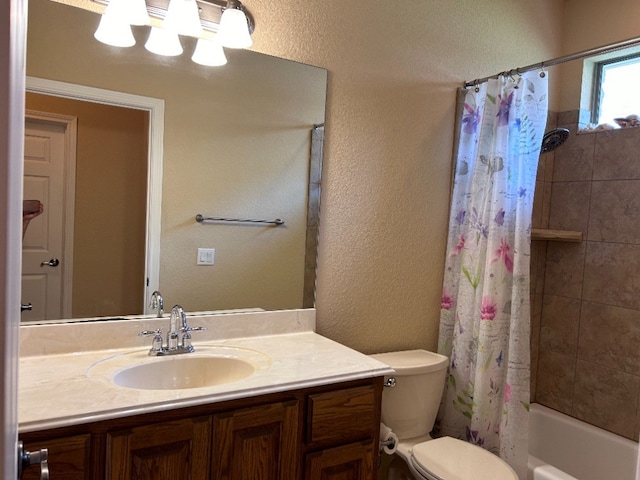 full bathroom featuring shower / bath combo with shower curtain, vanity, and toilet