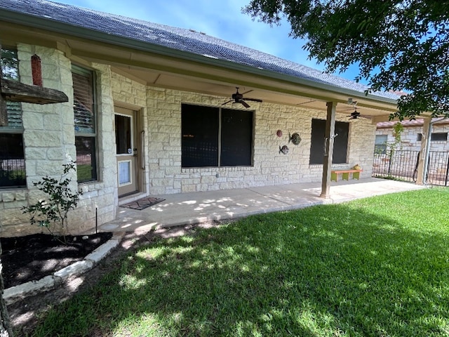 back of house featuring a lawn