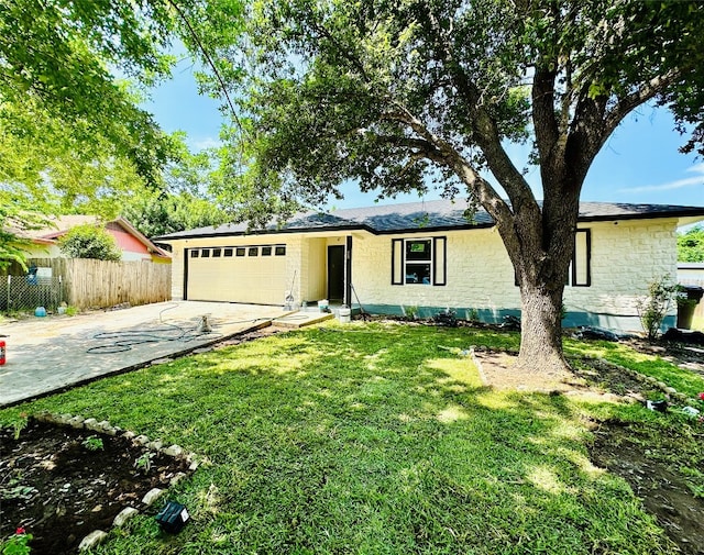 single story home with a garage and a front yard