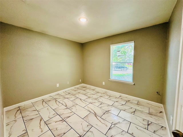 spare room with tile flooring