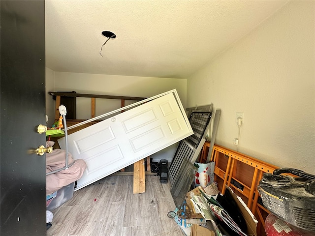 bedroom with hardwood / wood-style floors