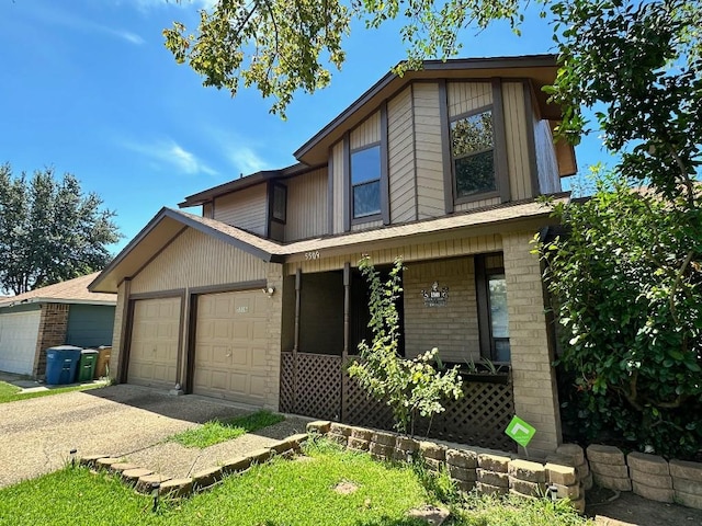 5509 Teri Rd, Austin, TX 78744 - view of front of house with covered porch, an attached garage, and concrete driveway