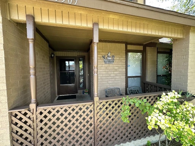 5509 Teri Rd, Austin, TX 78744 - property entrance with a porch and brick siding