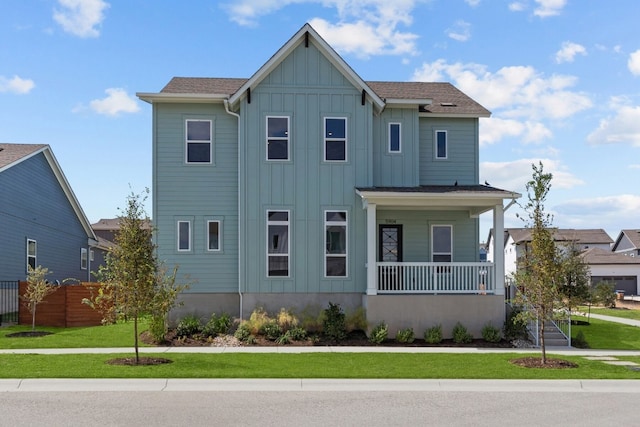 view of front of house featuring a front yard and a porch