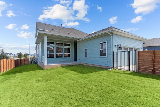 rear view of property featuring a yard