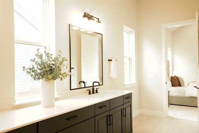 bathroom with vanity and a wealth of natural light