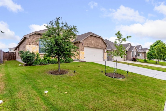 view of front of property with a front lawn and a garage