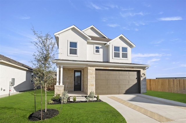 view of front of home with a front yard and a garage