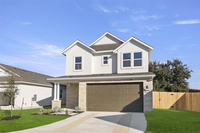 view of front facade with a front lawn and a garage