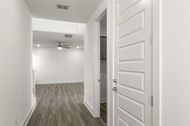 corridor featuring dark hardwood / wood-style flooring