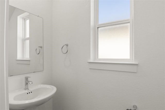 bathroom with sink and a healthy amount of sunlight