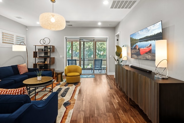 living room with dark hardwood / wood-style floors