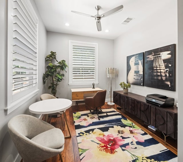 office space featuring ceiling fan, hardwood / wood-style floors, and a wealth of natural light