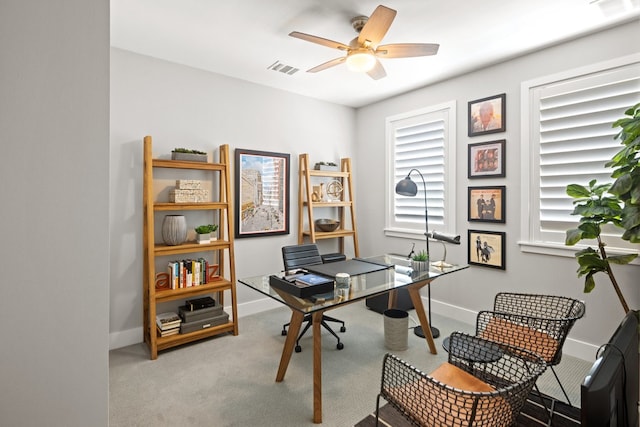 home office with ceiling fan and carpet floors