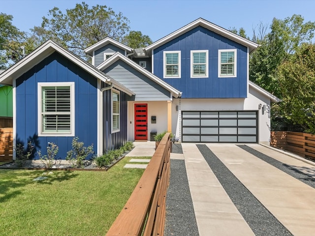 view of front of home featuring a garage and a front lawn