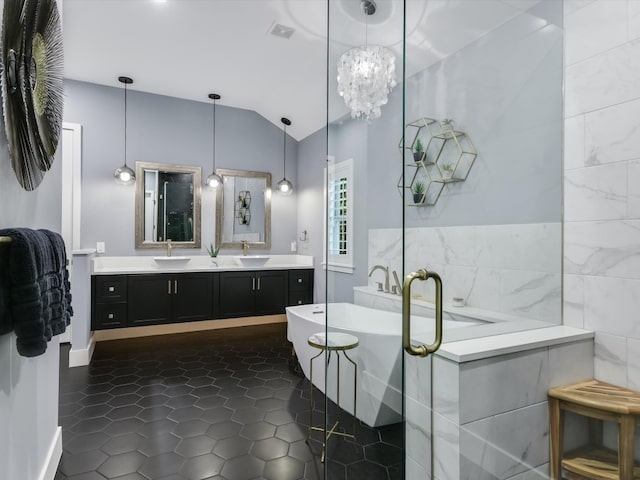 bathroom with lofted ceiling, vanity, tile walls, tile patterned flooring, and independent shower and bath