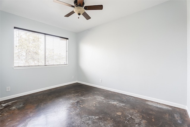 spare room with concrete floors and ceiling fan