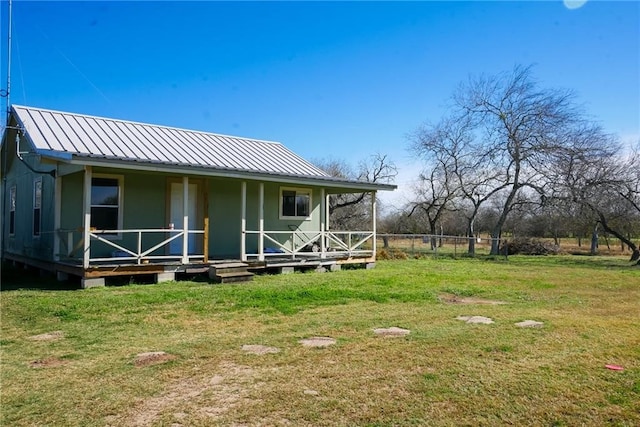 back of house with a yard