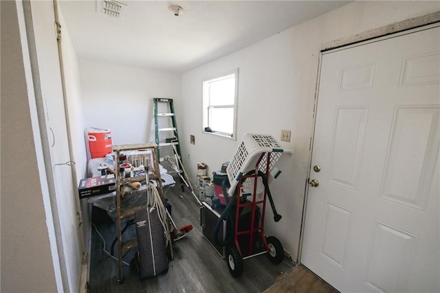 miscellaneous room with dark hardwood / wood-style floors