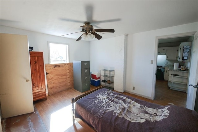 bedroom with ceiling fan and hardwood / wood-style flooring