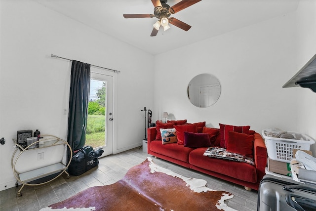 living room with ceiling fan and wood-type flooring