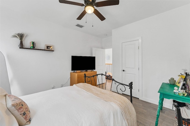 bedroom featuring wood-type flooring and ceiling fan