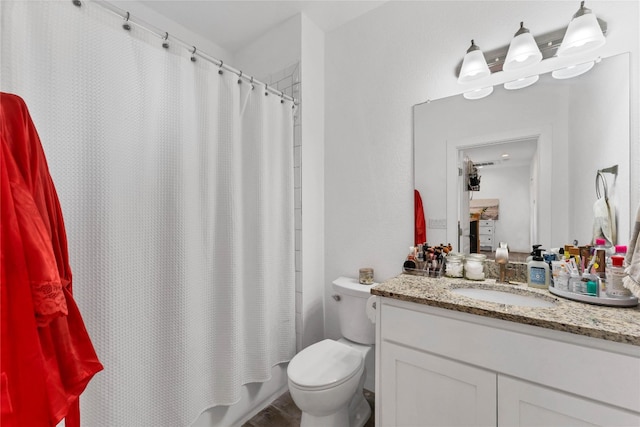 bathroom featuring vanity and toilet