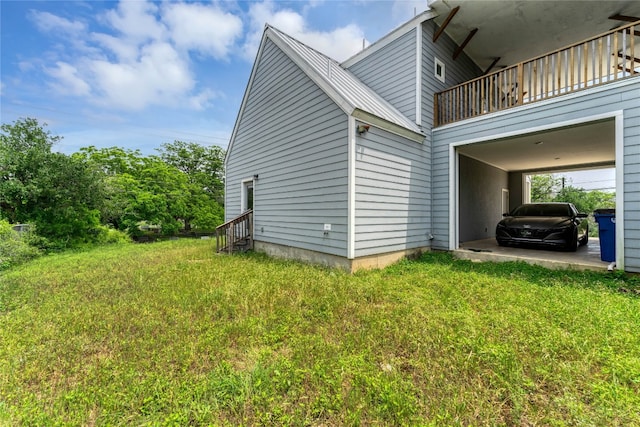 view of property exterior with a carport, a yard, and a balcony