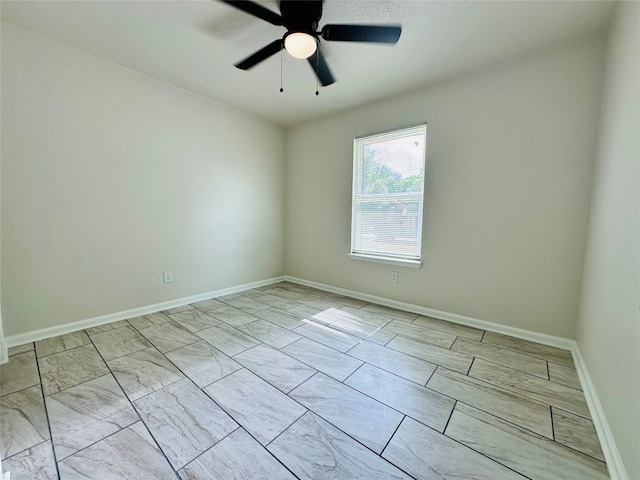 unfurnished room with light tile patterned floors and ceiling fan