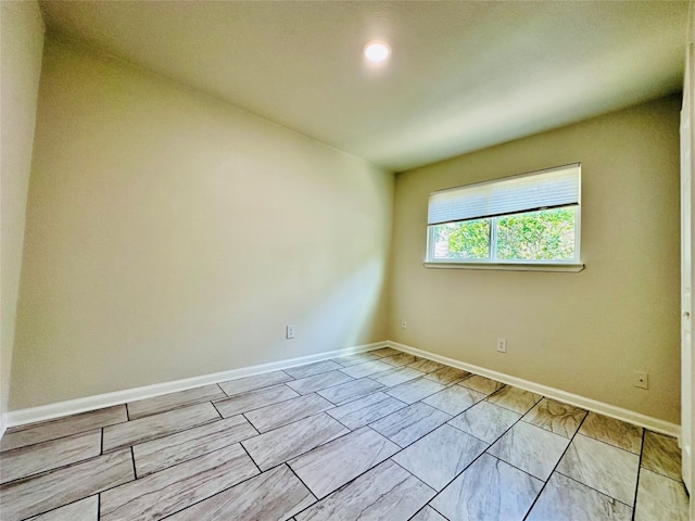 empty room with light tile patterned floors