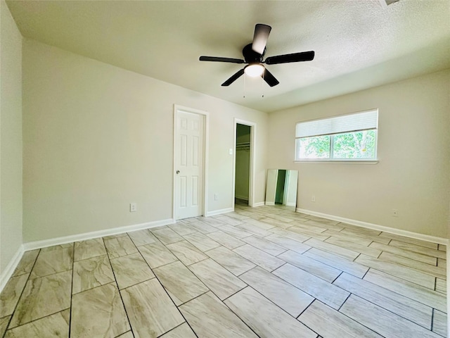 unfurnished room featuring light tile patterned floors and ceiling fan